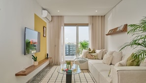 Deluxe Apartment | Living area | 60-inch Smart TV with digital channels, Netflix, streaming services