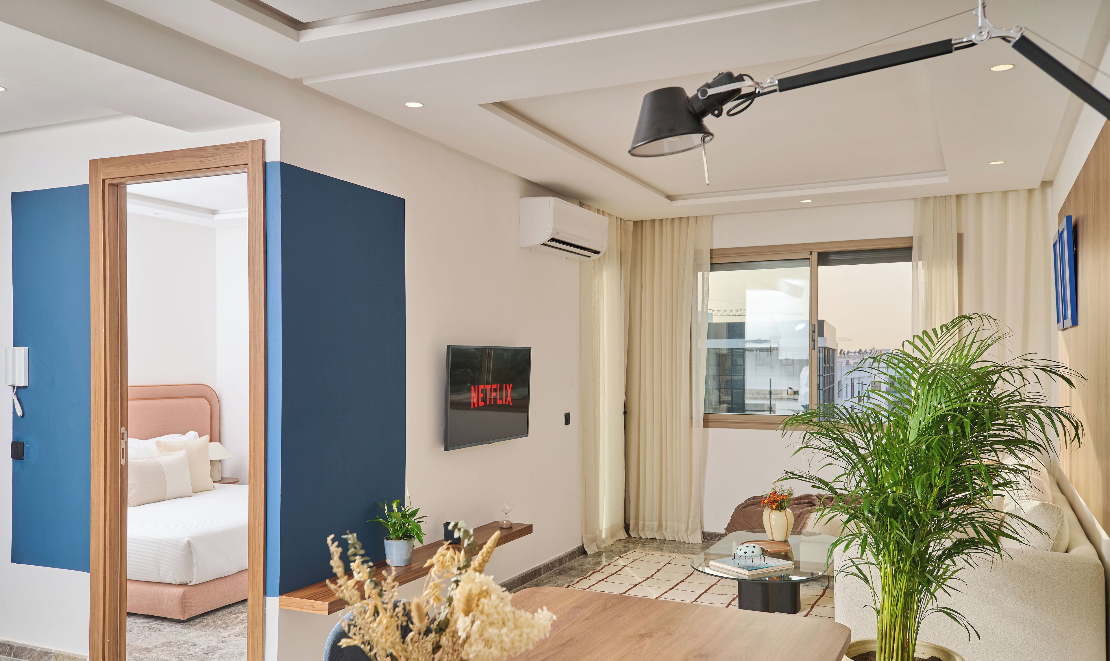 Comfort Apartment | Living area | 60-inch Smart TV with digital channels, Netflix, streaming services
