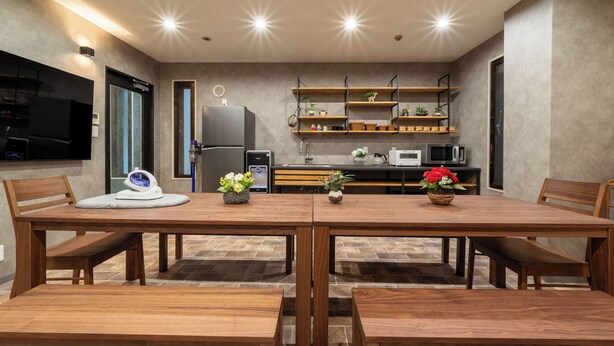 A modern kitchen with a dining area.