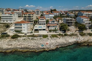 Stunning coastal views from balconies overlooking turquoise waters.