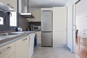 Apartment | Private kitchen | Microwave, oven, coffee/tea maker, high chair