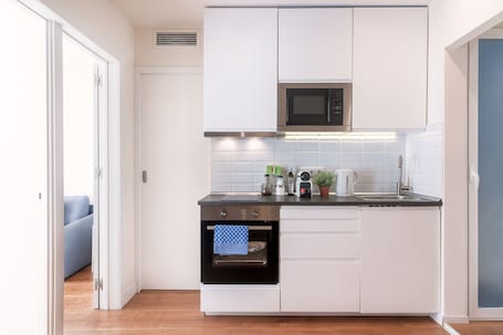 Apartment | Private kitchen | Microwave, oven, coffee/tea maker, highchair