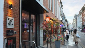 A hotel entrance with a sign for 'Z Hotels' and a 'Dry Riser' sign. - The Z Hotel Tottenham Court Road (London)