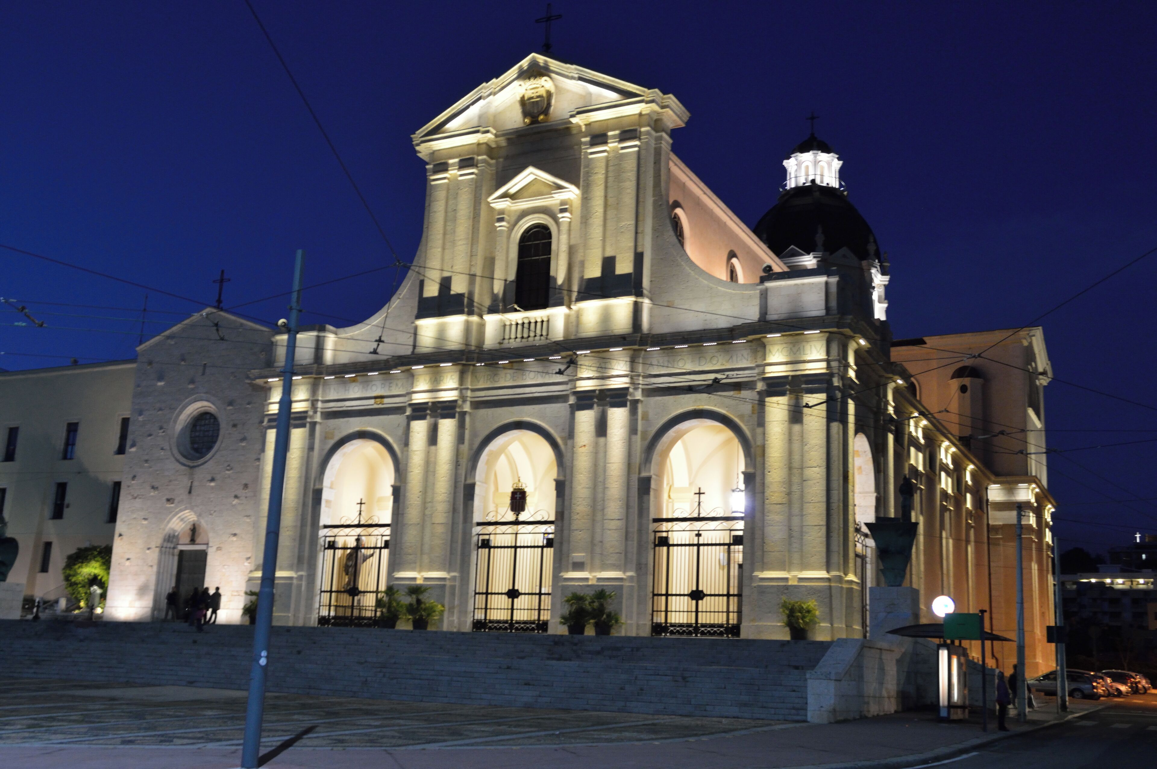 A historic church with a prominent bell tower and arched windows.