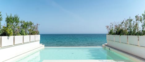 Outdoor pool, open 10:00 AM to 5:00 PM, pool umbrellas, sun loungers