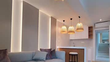 Executive Apartment, Sea View | Living area | TV