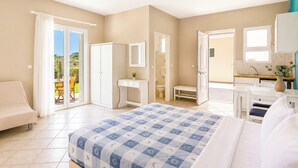 A bedroom with a bed, a desk, a chair, a wardrobe, and a bathroom. - Nautilos Hotel (Kefalonia)