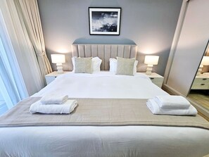 1 bedroom, desk, iron/ironing board, travel crib