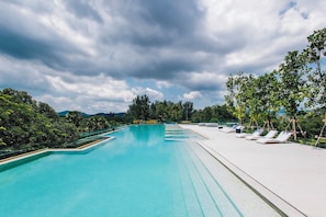Outdoor pool, pool umbrellas, pool loungers - Beachside Residences by NLA (Choeng Thale)