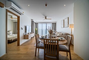 Deluxe Apartment, 1 Bedroom | Living area | 65-inch Smart TV with digital channels - Beachside Residences by NLA (Choeng Thale)