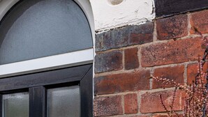 A brick wall with a black door and a house number 141. - Beeston Central House - near shops and University (Beeston)