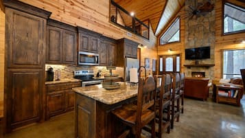 Cabin, Multiple Beds, Hot Tub, Garden View (Logged Out) | Private kitchen | Fridge, microwave, oven, stovetop