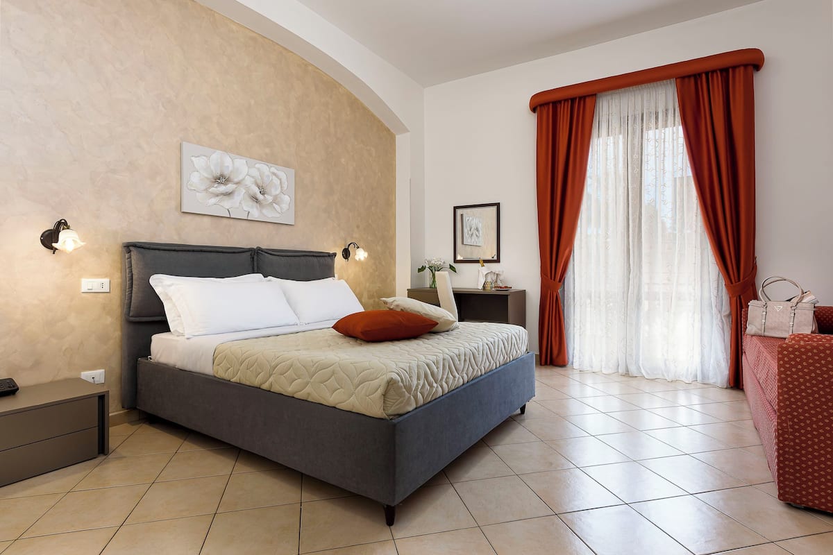 Standard Quadruple Room | 1 bedroom, in-room safe, desk, blackout drapes