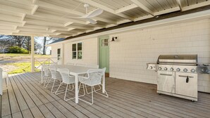 An outdoor patio with a table and chairs, a grill, and a covered area with a ceiling fan. - Walk to Lake Texoma: Kingston Retreat w/ Deck! (Kingston)