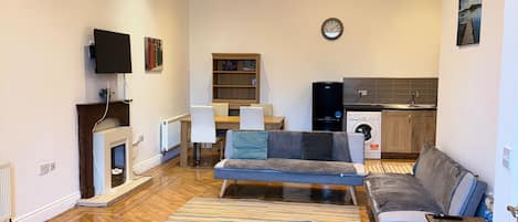 Apartment | Living area | TV, fireplace