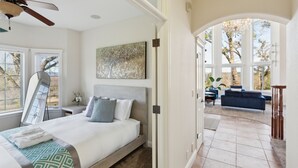 A bedroom with a bed, a ceiling fan, a large window, and a view of the outdoors. - Stunning Mountain Retreat With Unmatched Views 5 Bedroom Estate (Oak Run)