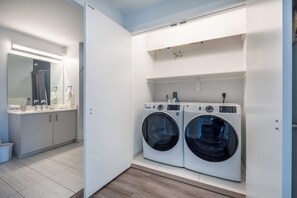 Shower, hair dryer, towels