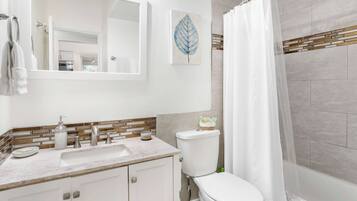 Shower, hair dryer, towels