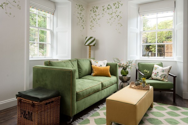 Grooms Cottage - comfortable two-seater sofa and chair in the sitting room