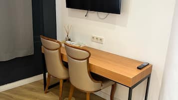 Triple Room | Minibar, in-room safe, desk, laptop workspace