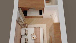 A modern bedroom with a bed, bedside tables, and a small desk area. - Charming modern Studio with AC - Le Marais (Paris)