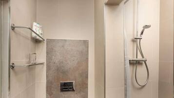 Shower, hair dryer, towels, shampoo