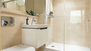 Shower, hair dryer, towels, shampoo