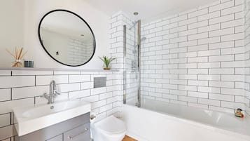 Shower, hair dryer, towels, shampoo