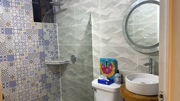 Shower, towels, soap, toilet paper
