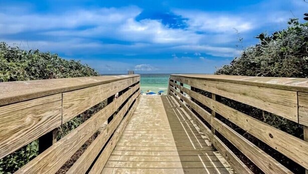 A wooden boardwalk leading to a beach with a clear view of the ocean and a partly cloudy sky. - 🌴Walk to Beach-3BR-Lake View-Seagrove Highlands 1304🌴 (Santa Rosa Beach)