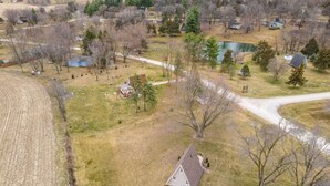 A rural landscape with a house, a pond, and a field. - 🏠 Mid-Century A-Frame Near Galena | Stargaze | Couples Retreat | 1 Bed/1 Bath (Elizabeth)