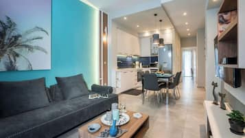 Luxury Apartment, City View | Living area | 55-inch Smart TV with satellite channels, video game console