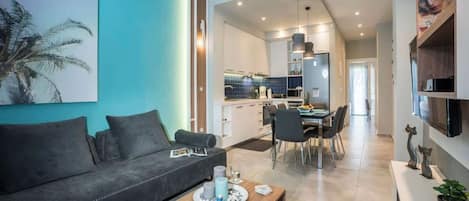 Luxury Apartment, City View | Living area | 55-inch Smart TV with satellite channels, video-game console