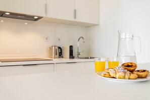 Dishwasher, coffee/tea maker, cookware/dishes/utensils