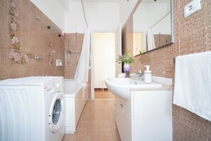Hair dryer, bidet, towels, soap