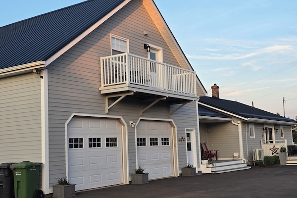This is the back of the house where you find your entrance as well as parking.