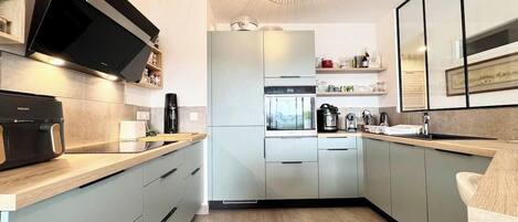 Fridge, microwave, stovetop, coffee/tea maker