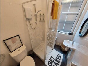 Shower, towels, toilet paper