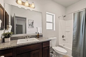 Shower, hair dryer, towels, shampoo