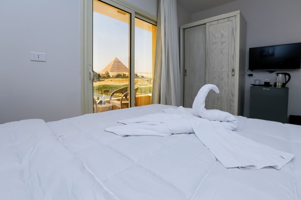Deluxe Double Room, Balcony, Mountain View | Minibar, in-room safe, individually decorated, desk