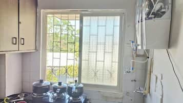 Fridge, microwave, cookware/dishes/utensils