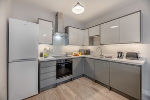 Fridge, oven, cookware/dishes/utensils