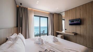 Deluxe Double Room, Balcony, Sea View | Minibar, in-room safe, desk, blackout drapes