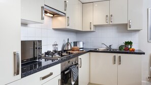 Fridge, microwave, oven, cookware/dishes/utensils