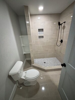 Shower, hair dryer, towels, soap