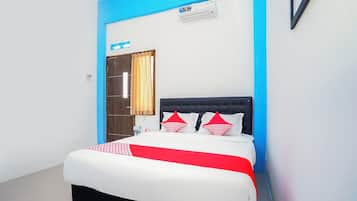 Laptop workspace, bed sheets