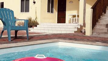Enjoy a refreshing dip in the pool surrounded by a spacious deck.