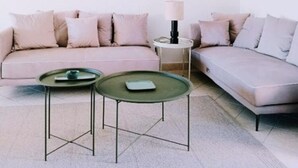 A minimalist living room with a sofa, two coffee tables, a lamp, and a wall art piece. - Large Apartment With VIEW OF THE SEA AND CAP Canaille - free parking (Cassis)