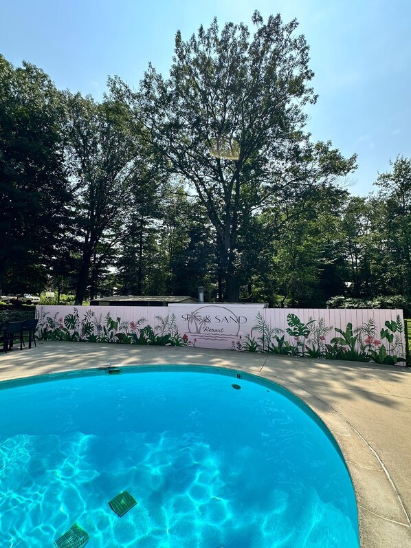 Seasonal outdoor pool, pool loungers