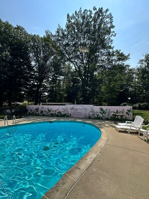 Seasonal outdoor pool, pool loungers